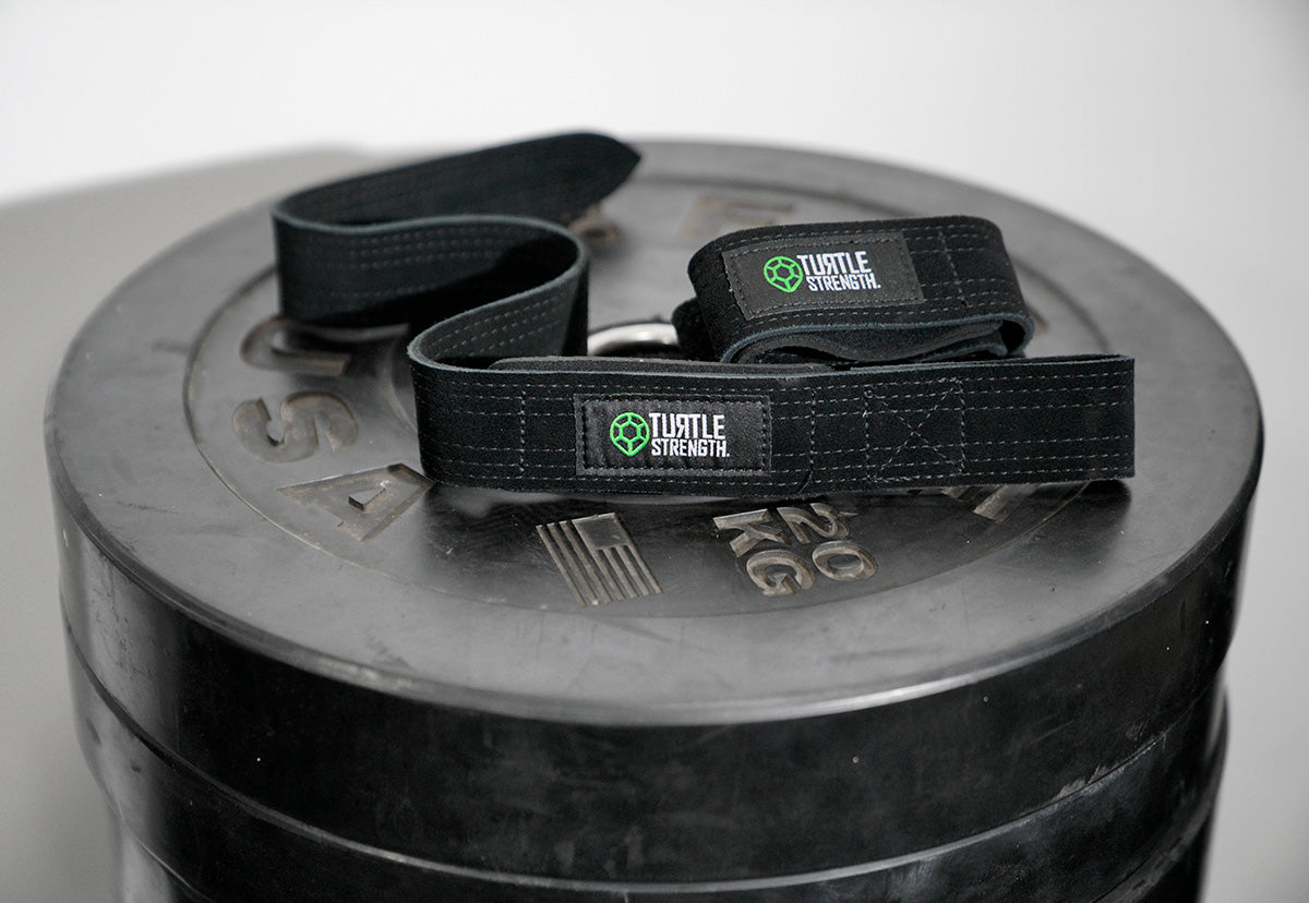 lifting straps on barbell rubber plates