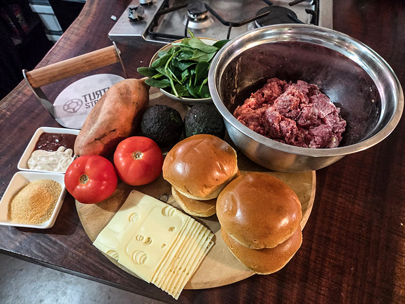 burger ingredients layed out on table