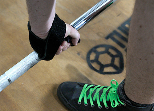 lifting straps about to wrapped around bar