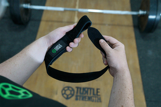 hands holding a lifting strap